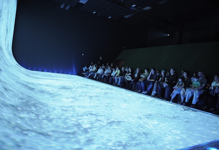 Immersive Design at World Expo Zaragoza: Dutch Pavilion Exhibition. Experience the essence of Water and Sustainable Development through our captivating Dutch Pavilion exhibition. As visitors stand on the 'shore,' they are treated to a cinematic journey about water and the Netherlands through an impressive floor and wall projection. Design by Studio Königshausen.